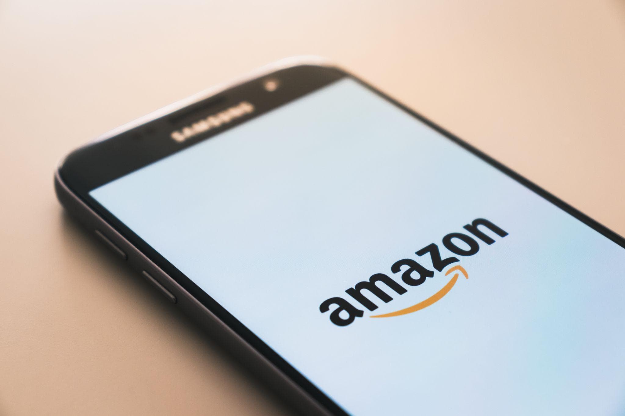 The Amazon logo on a mobile phone screen